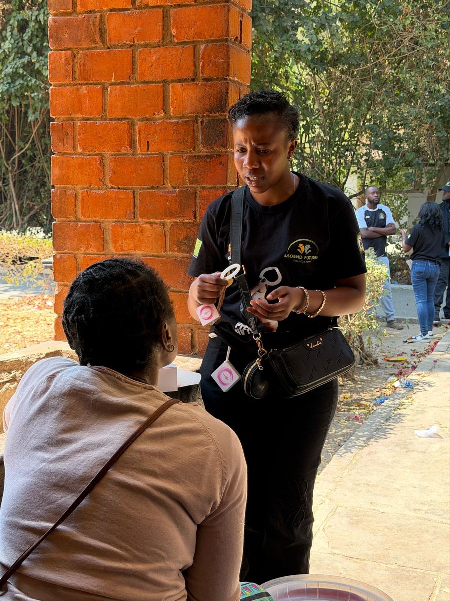 AFF staff member explaining HIV prevention options to a community member